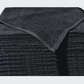 Stack of black Microterry cotton auto towels with the top towel folded back to show the texture