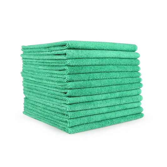 Stack of folded green microfiber cleaning cloths on a white background.